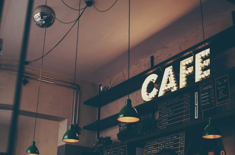 People chatting over coffee at a busy cafe